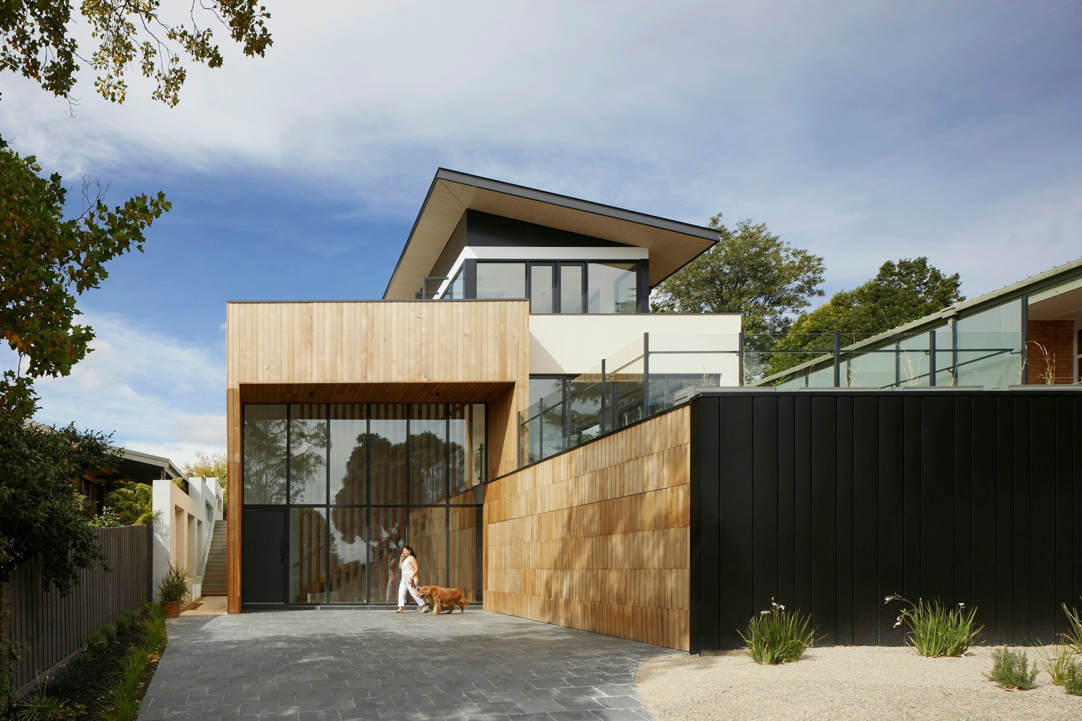 Professionally directed exterior photograph with stronger atmosphere and human scale